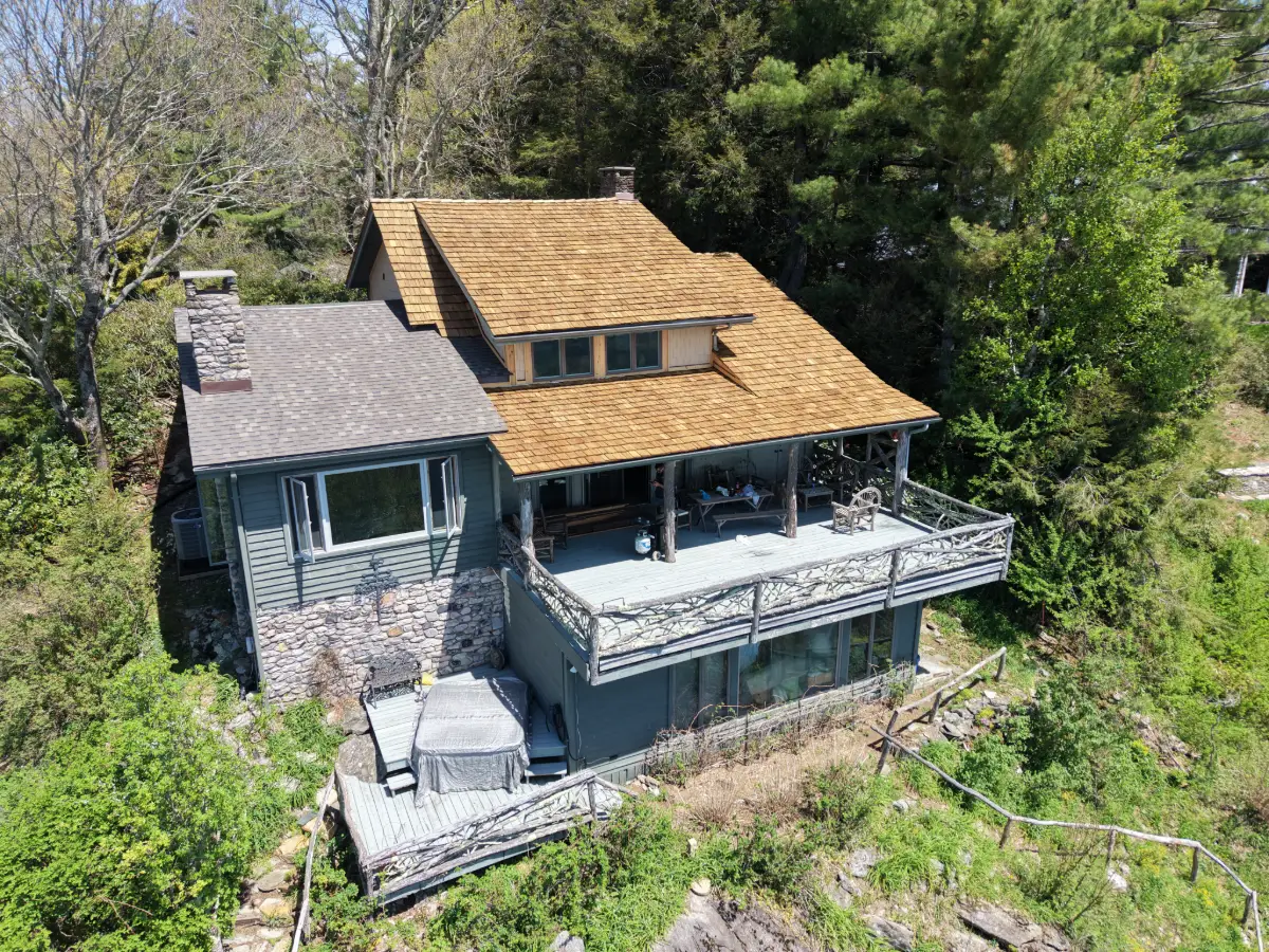 Cedar shake roof replacement on a hillside mountain home in the NC High Country