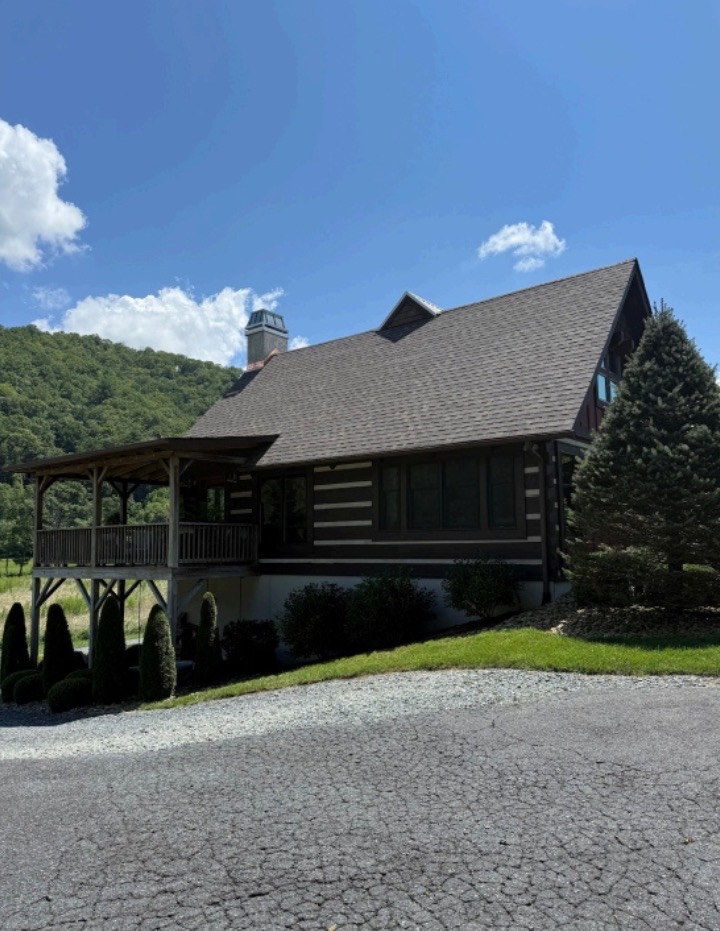 Seamless aluminum gutters on a mountain home in Watauga County